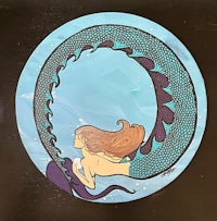a painting of a mermaid in a circle