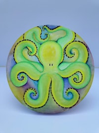 an octopus is painted on a plate